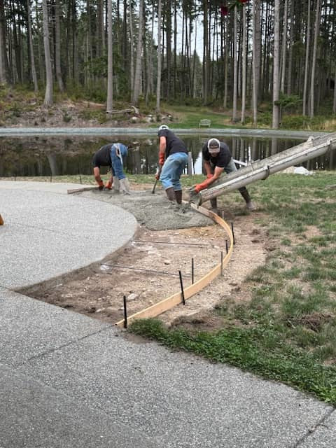 concrete workers pouring pad