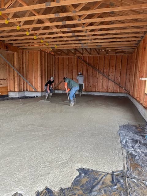 concrete workers pouring slab